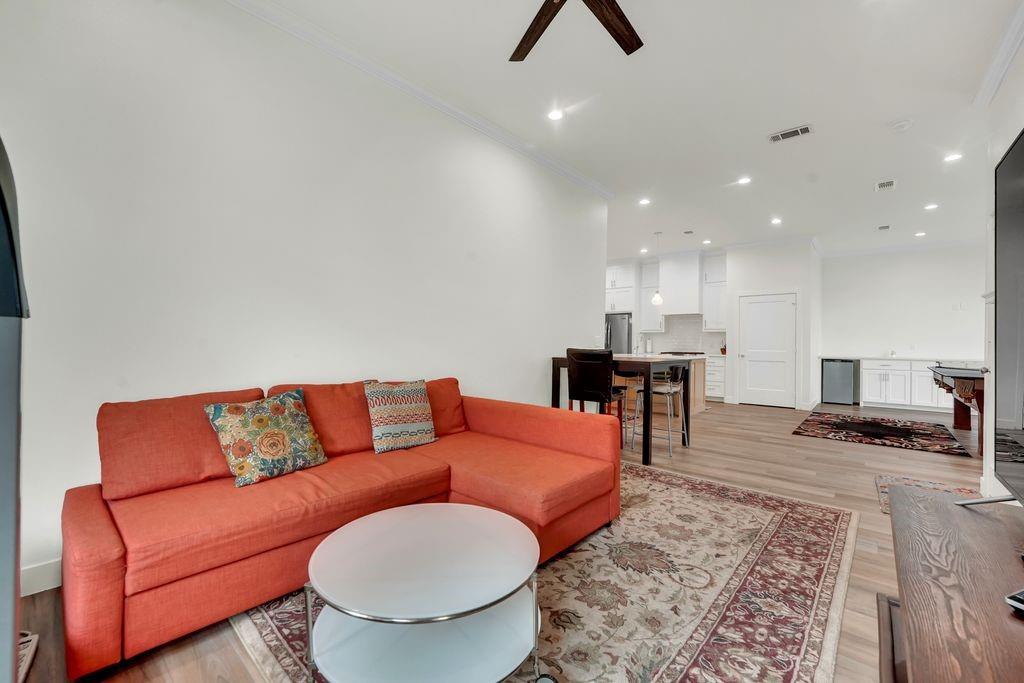 4035 Cedarview Road Dallas, TX 75287 - Photo 28 of 31 a living room with furniture and kitchen view