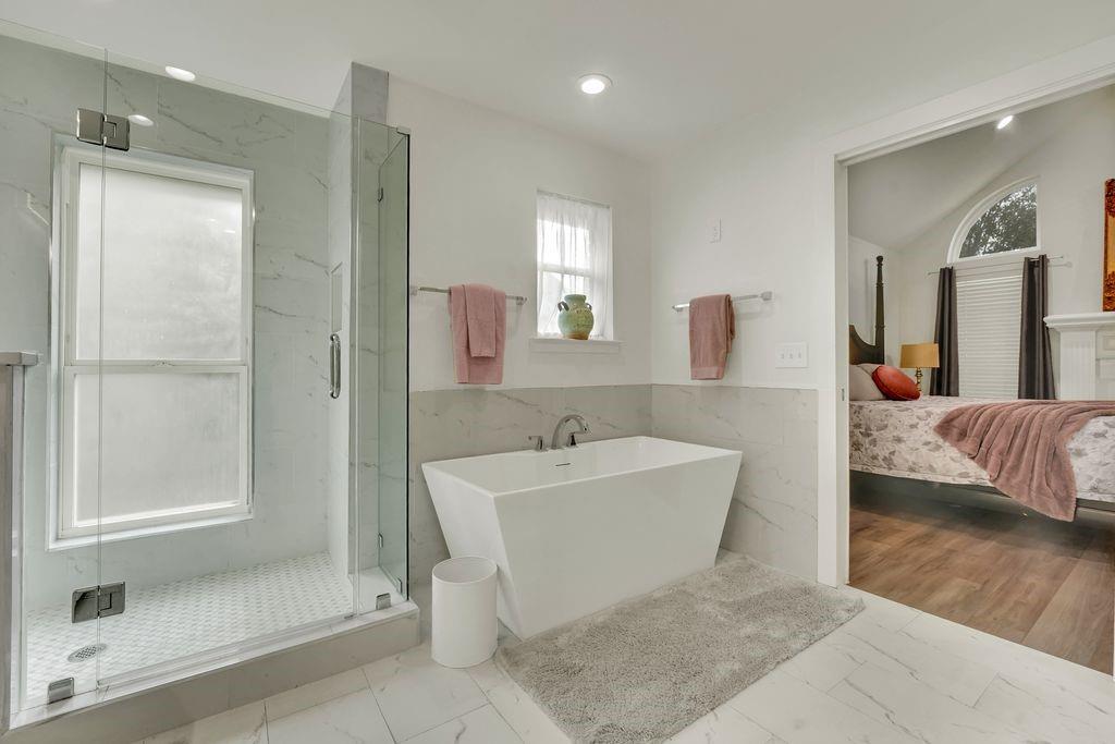 4035 Cedarview Road Dallas, TX 75287 - Photo 7 of 31 a spacious bathroom with a bathtub and shower