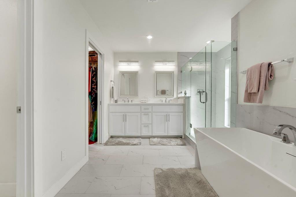 4035 Cedarview Road Dallas, TX 75287 - Photo 8 of 31 a spacious bathroom with a tub sink shower and mirror