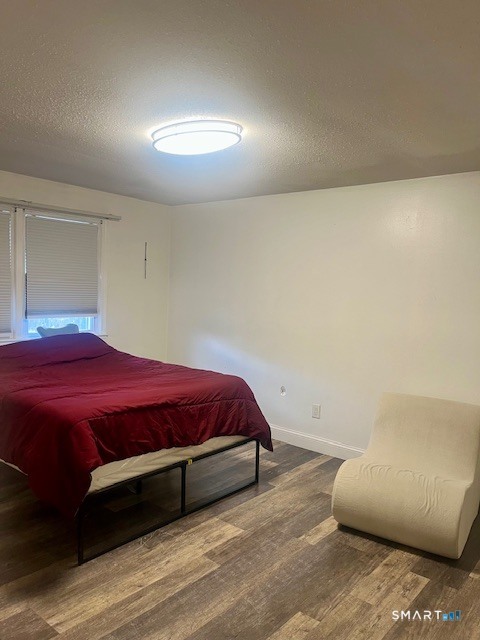 34 Keats Road Meriden, CT 06451 - Photo 12 of 19 a bedroom with a bed and a lamp