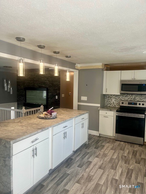 34 Keats Road Meriden, CT 06451 - Photo 5 of 19 a large kitchen with a stove and a sink