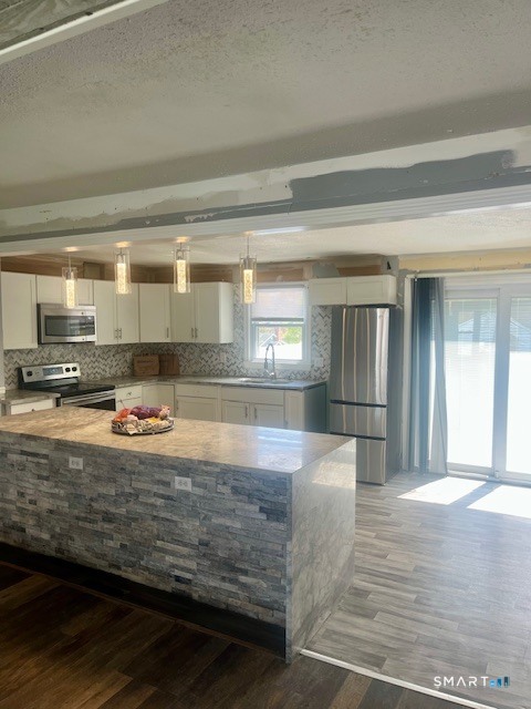 34 Keats Road Meriden, CT 06451 - Photo 6 of 19 a view of a kitchen with kitchen island a sink stainless steel appliances and cabinets