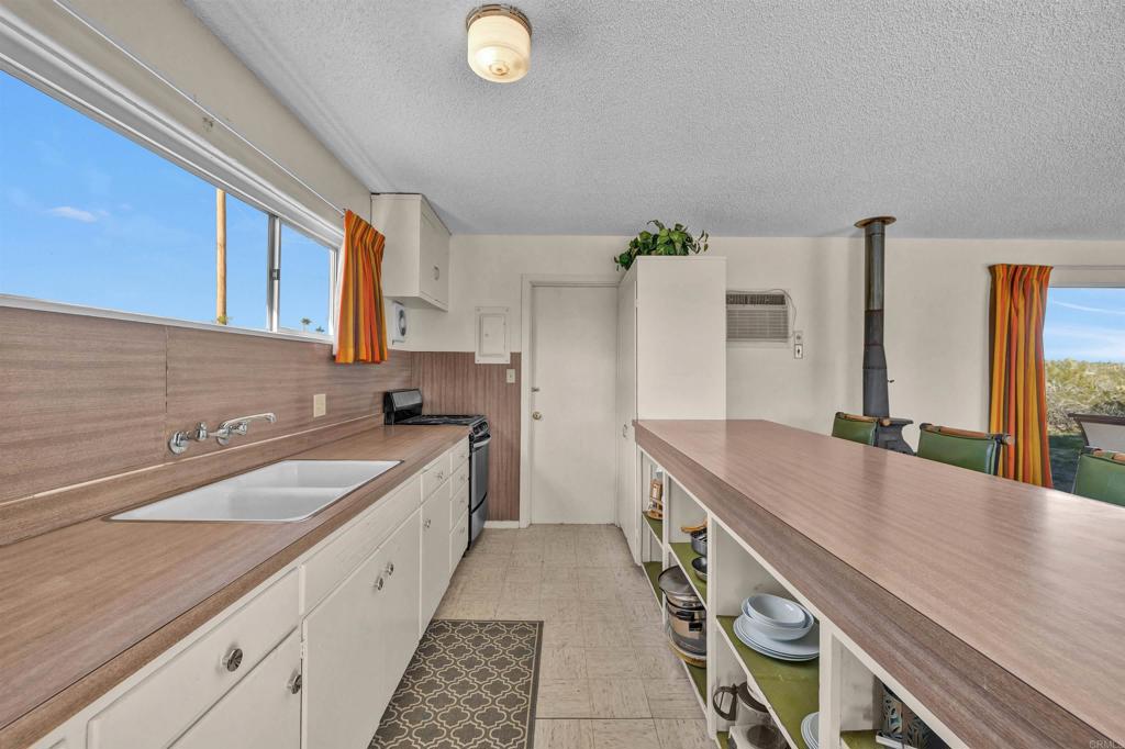 4235 Fletcher Road Borrego Springs, CA 92004 - Photo 11 of 31 a kitchen with a sink and cabinets