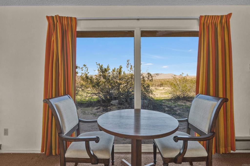 4235 Fletcher Road Borrego Springs, CA 92004 - Photo 13 of 31 a view of a dining room with furniture window and outside view