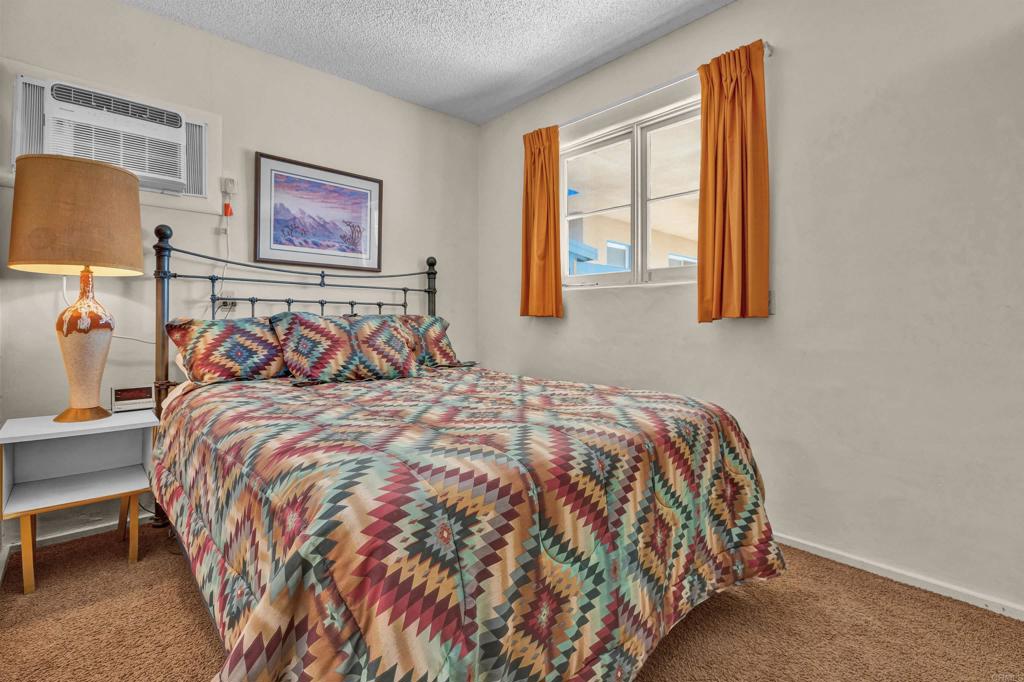 4235 Fletcher Road Borrego Springs, CA 92004 - Photo 14 of 31 a bed sitting in a bedroom next to a window