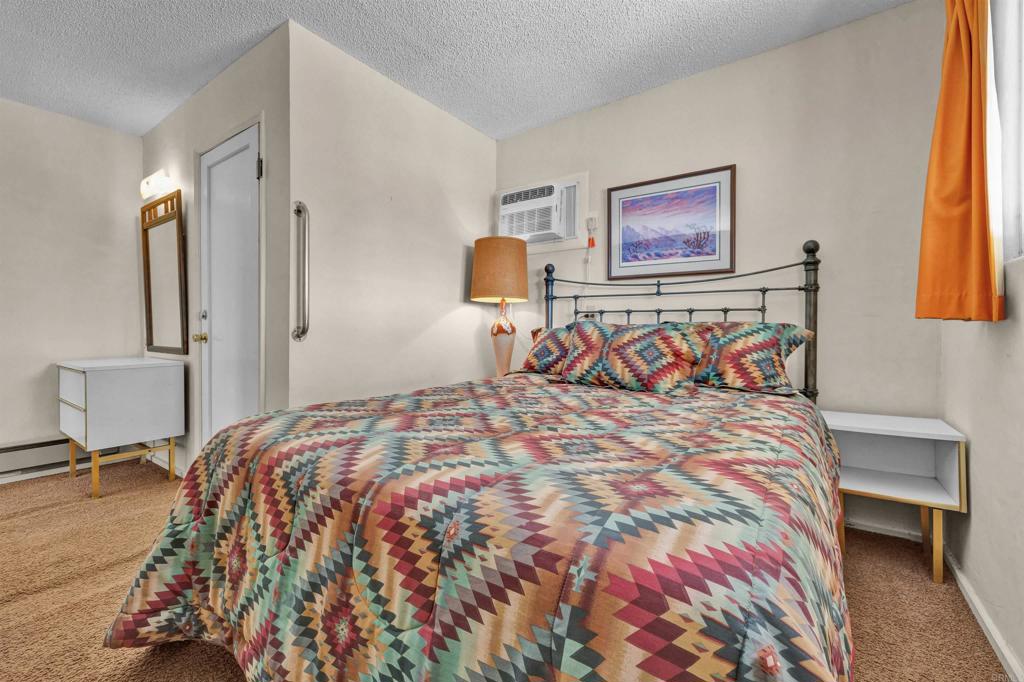 4235 Fletcher Road Borrego Springs, CA 92004 - Photo 15 of 31 a bedroom with a bed and a painting on the wall