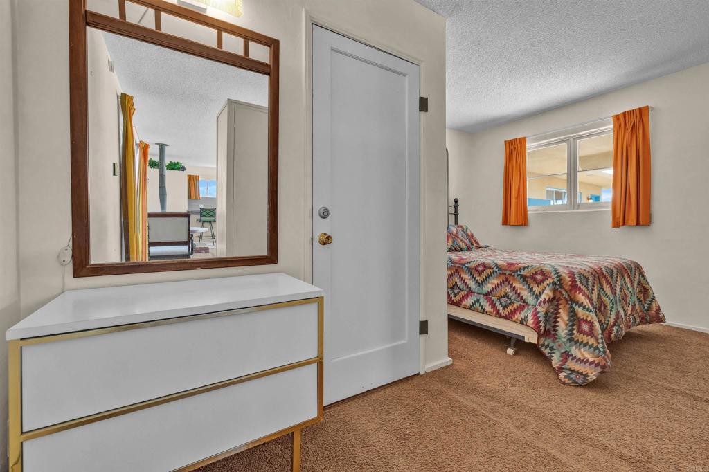 4235 Fletcher Road Borrego Springs, CA 92004 - Photo 16 of 31 a bedroom with a bed and a window