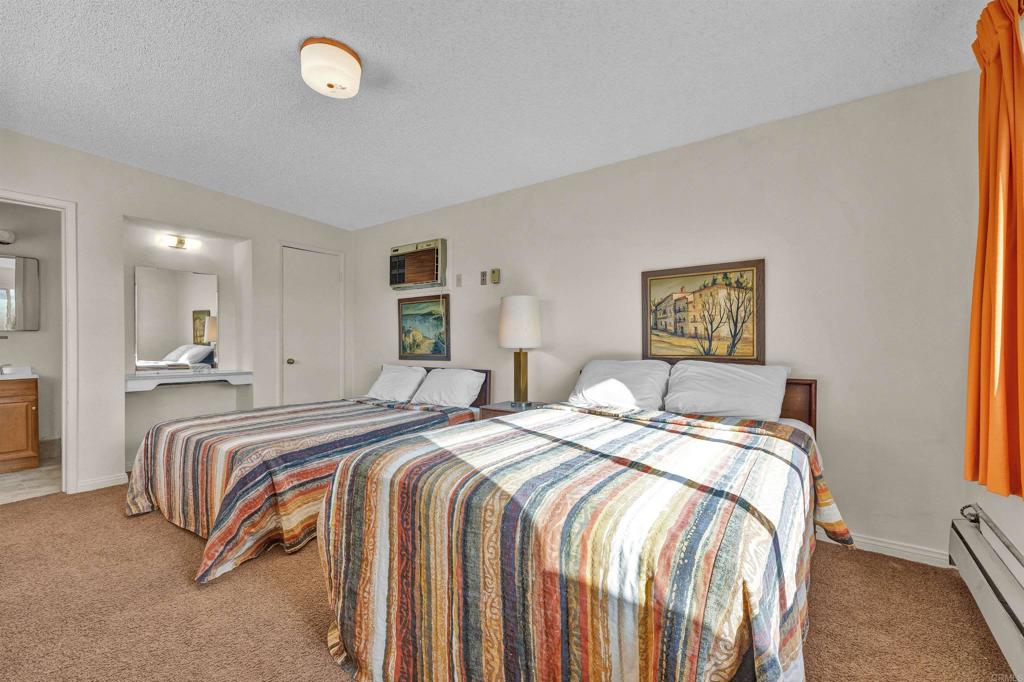 4235 Fletcher Road Borrego Springs, CA 92004 - Photo 20 of 31 a bed room with two bed and a night stand