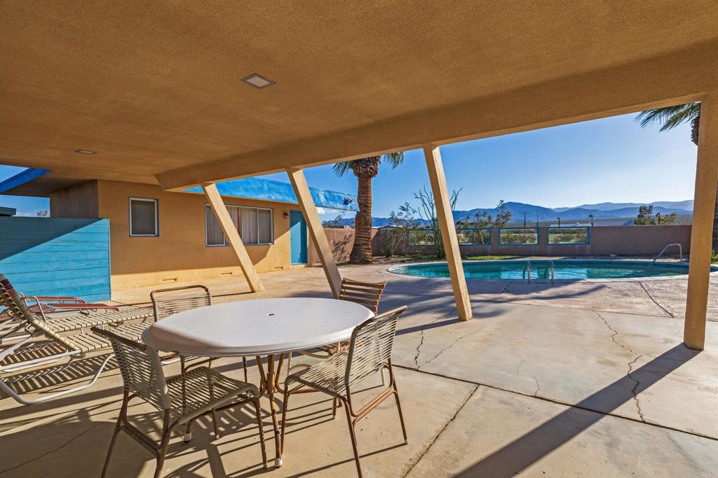 4235 Fletcher Road Borrego Springs, CA 92004 - Photo 25 of 31 a view of a patio with a table and chairs