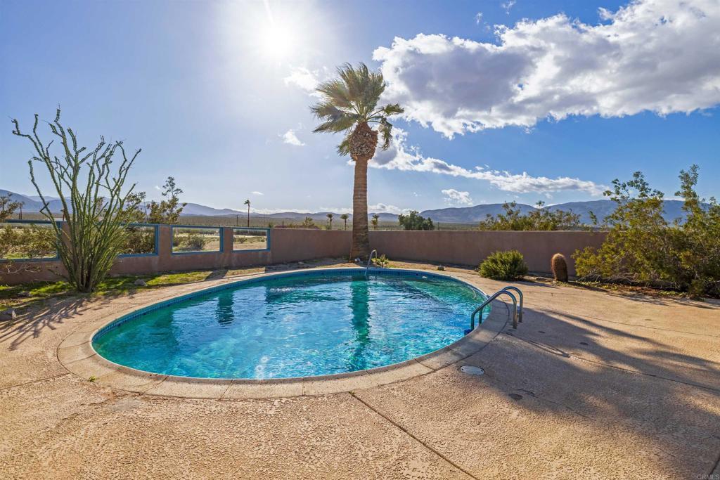 4235 Fletcher Road Borrego Springs, CA 92004 - Photo 27 of 31 a view of a swimming pool with a yard