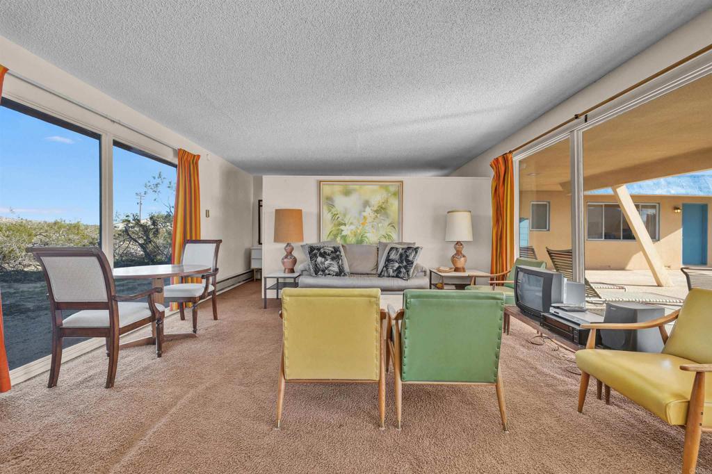 4235 Fletcher Road Borrego Springs, CA 92004 - Photo 4 of 31 a living room with furniture and a large window