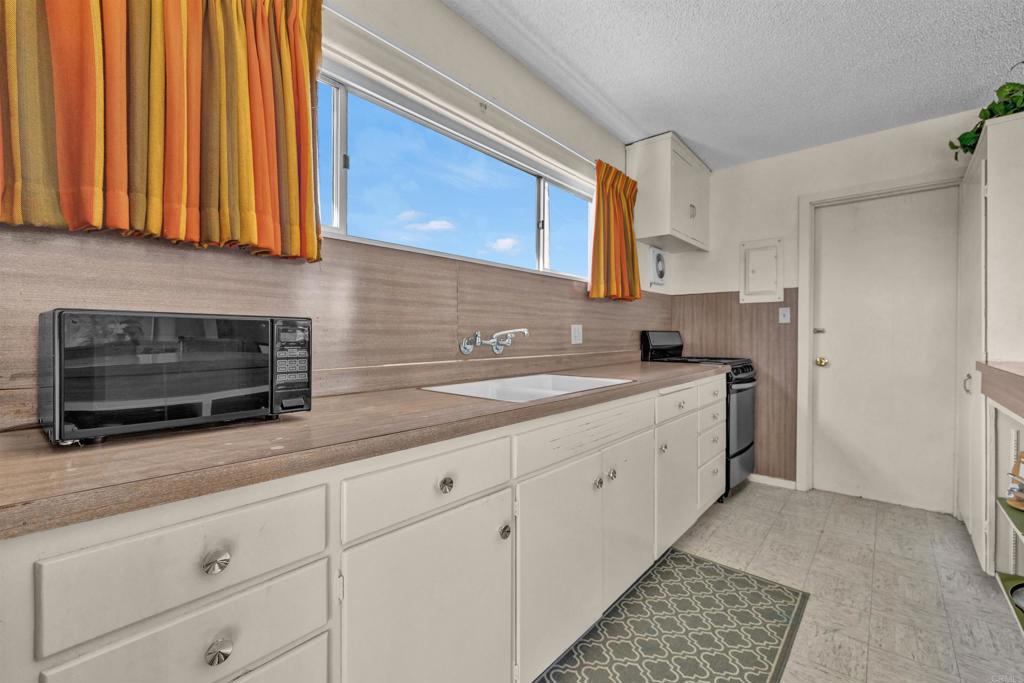 4235 Fletcher Road Borrego Springs, CA 92004 - Photo 9 of 31 a kitchen with granite countertop cabinets stainless steel appliances and a sink