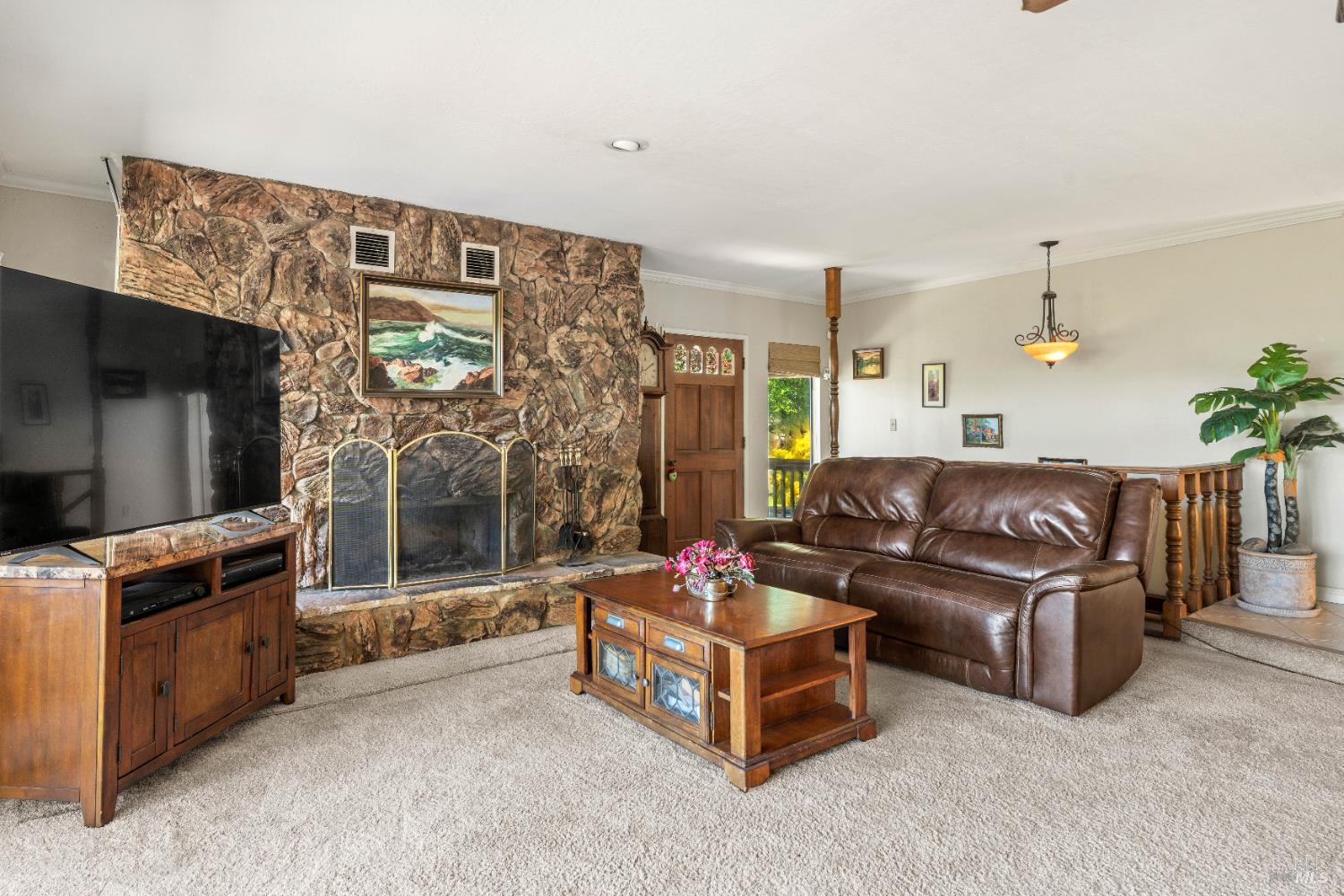 4901 Eastside Calpella Road Ukiah, CA 95482 - Photo 3 of 35 a living room with furniture and a flat screen tv