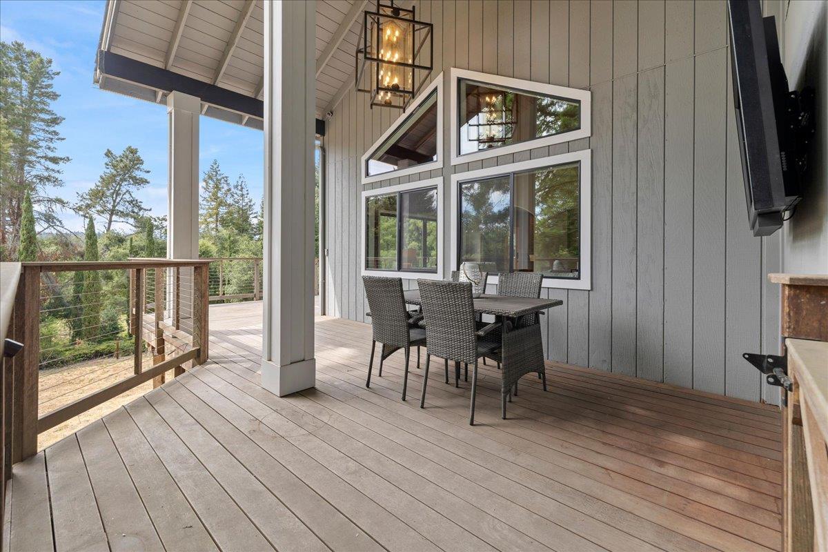 23435 Summit Road Los Gatos, CA 95033 - Photo 19 of 86 a view of a house with a patio and wooden floor