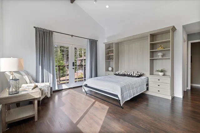 a view of a swimming pool with a couches and chairs