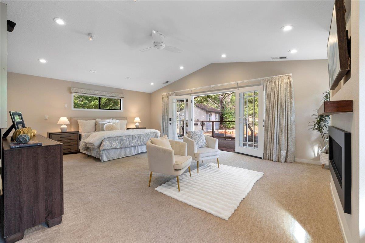 23435 Summit Road Los Gatos, CA 95033 - Photo 36 of 86 a living room with furniture a large window and a flat screen tv