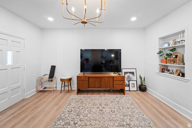 257 200 South Provo, UT 84606 - Photo 11 of 40 Living room featuring light wood finished floors, suspended lighting, and built in features