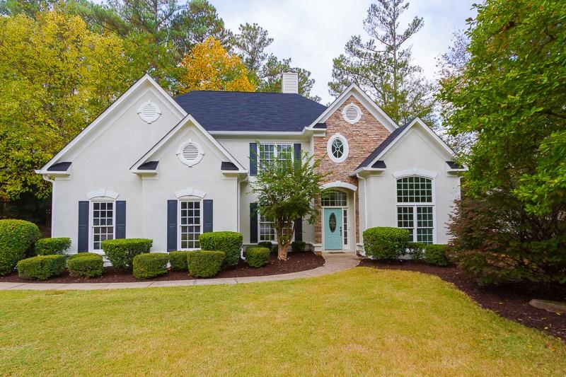 515 Park Creek Ridge Alpharetta, GA 30005 - Photo 1 of 1 a front view of a house with a yard and garage