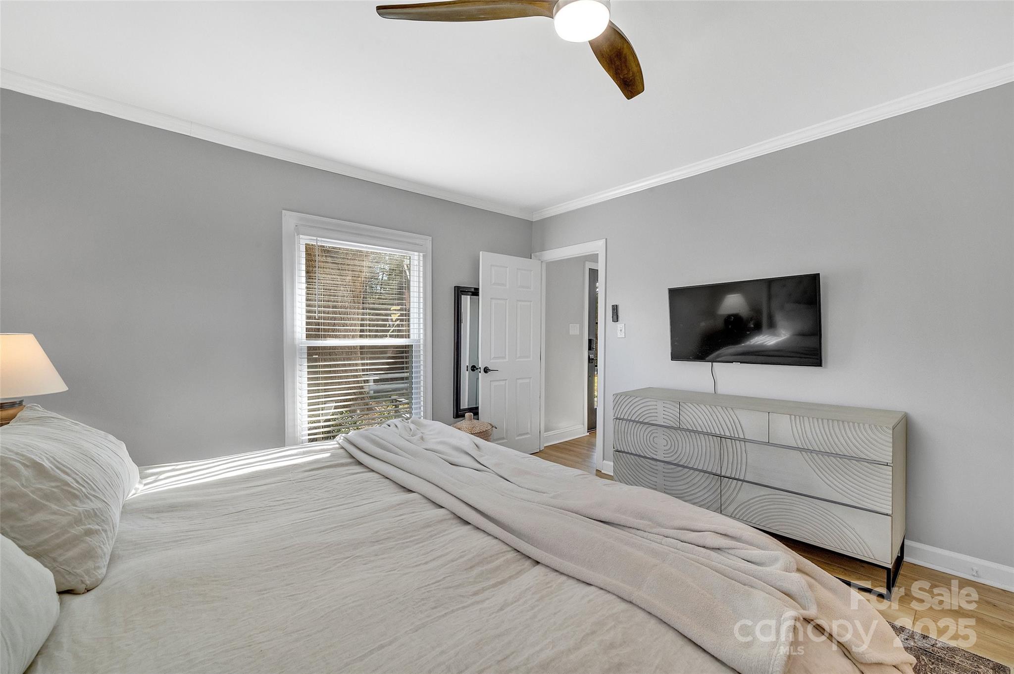 3433 Grey Road Davidson, NC 28036 - Photo 11 of 25 a bedroom with a bed and a flat screen tv