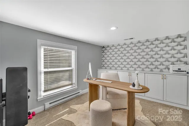 a view of dining room and window with furniture