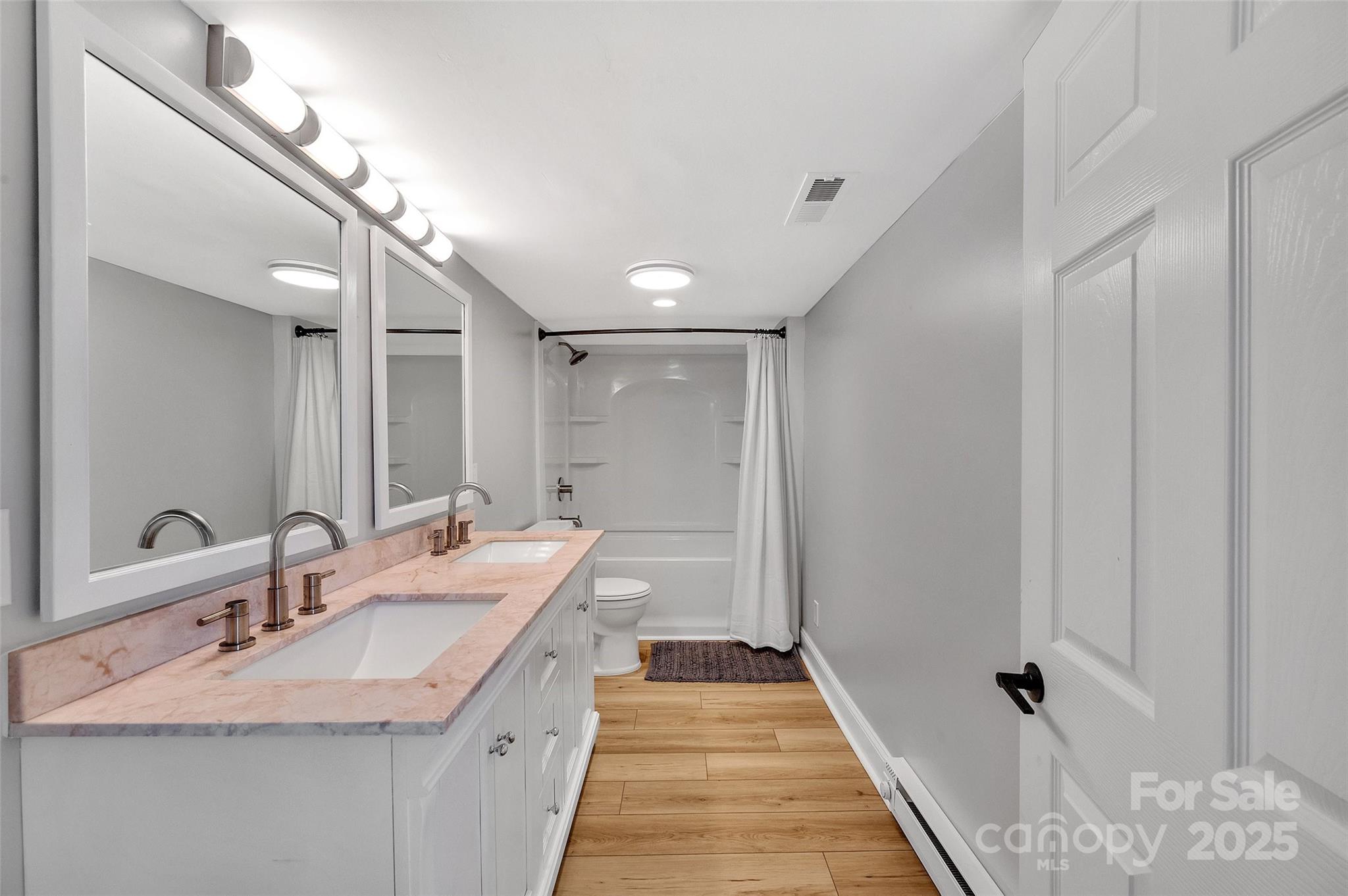 3433 Grey Road Davidson, NC 28036 - Photo 19 of 25 a bathroom with a double vanity sink and a mirror
