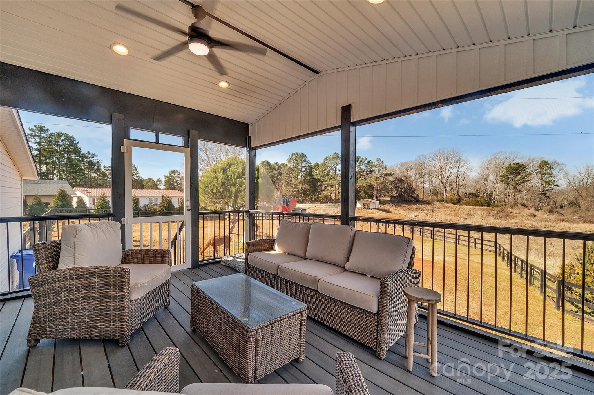 3433 Grey Road Davidson, NC 28036 - Photo 21 of 25 a balcony with furniture and a floor to ceiling window