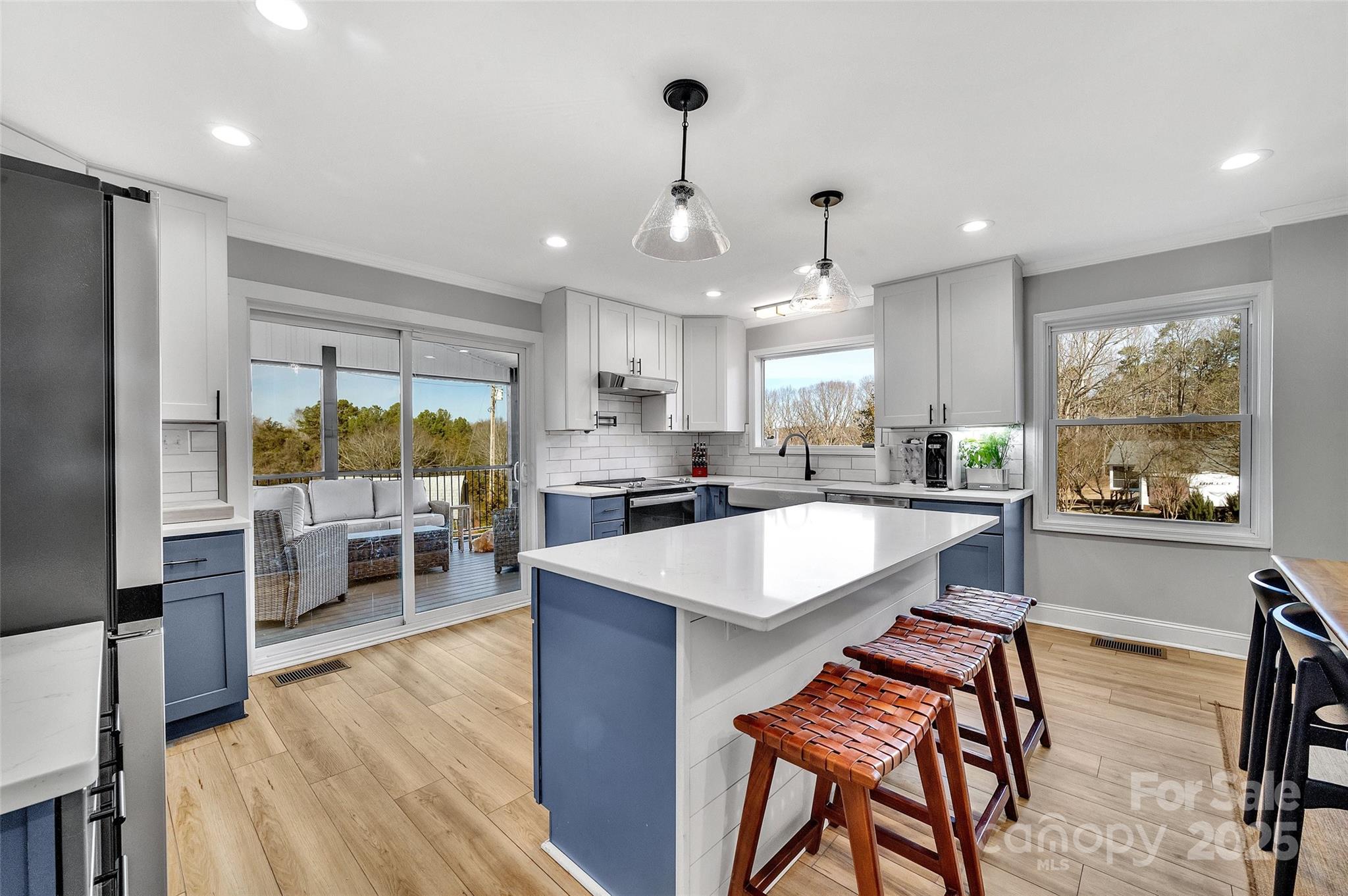 3433 Grey Road Davidson, NC 28036 - Photo 5 of 25 a large kitchen with a table and chairs