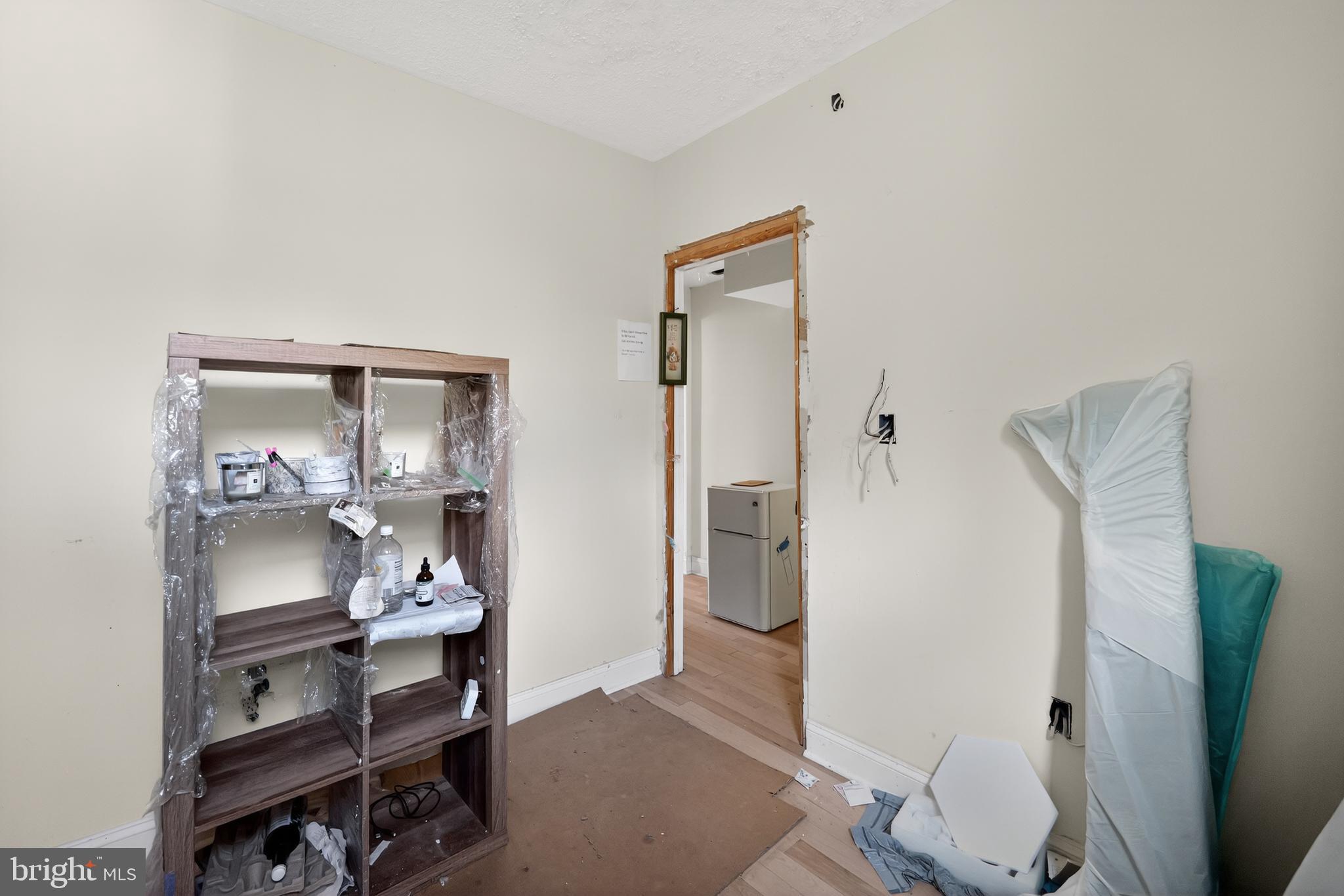 714 Portland Street Baltimore, MD 21230 - Photo 16 of 18 a view of room with wooden floor and bathroom
