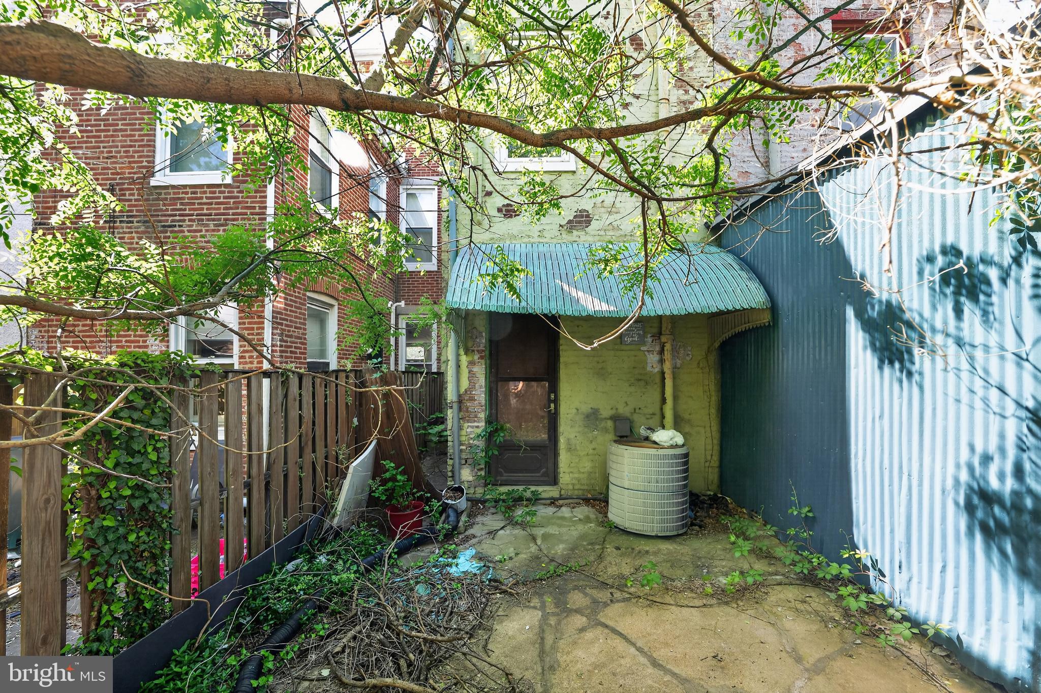 714 Portland Street Baltimore, MD 21230 - Photo 2 of 18 a view of a chair and table in backyard of the house