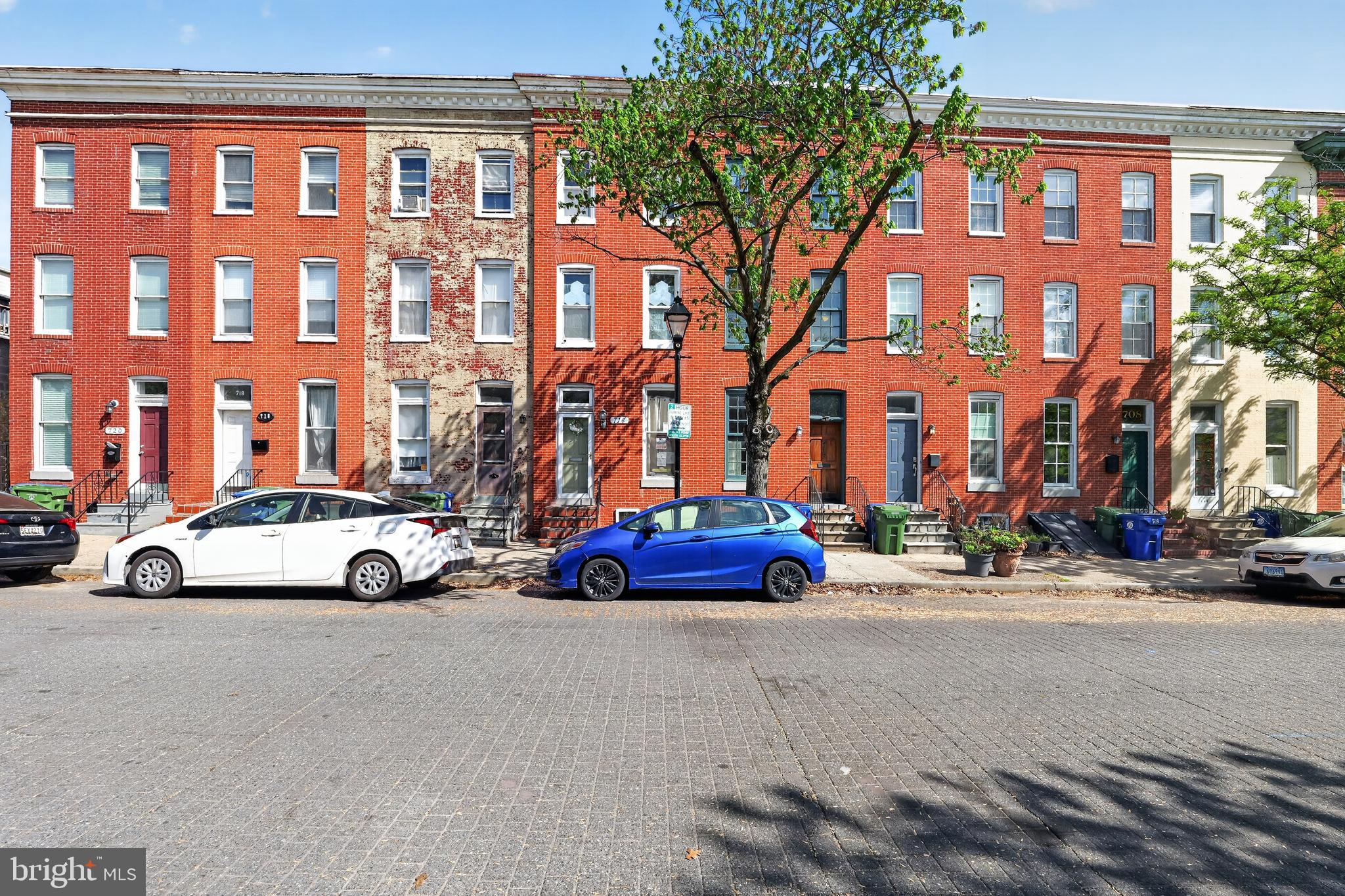 714 Portland Street Baltimore, MD 21230 - Photo 3 of 18 a view of a street with cars