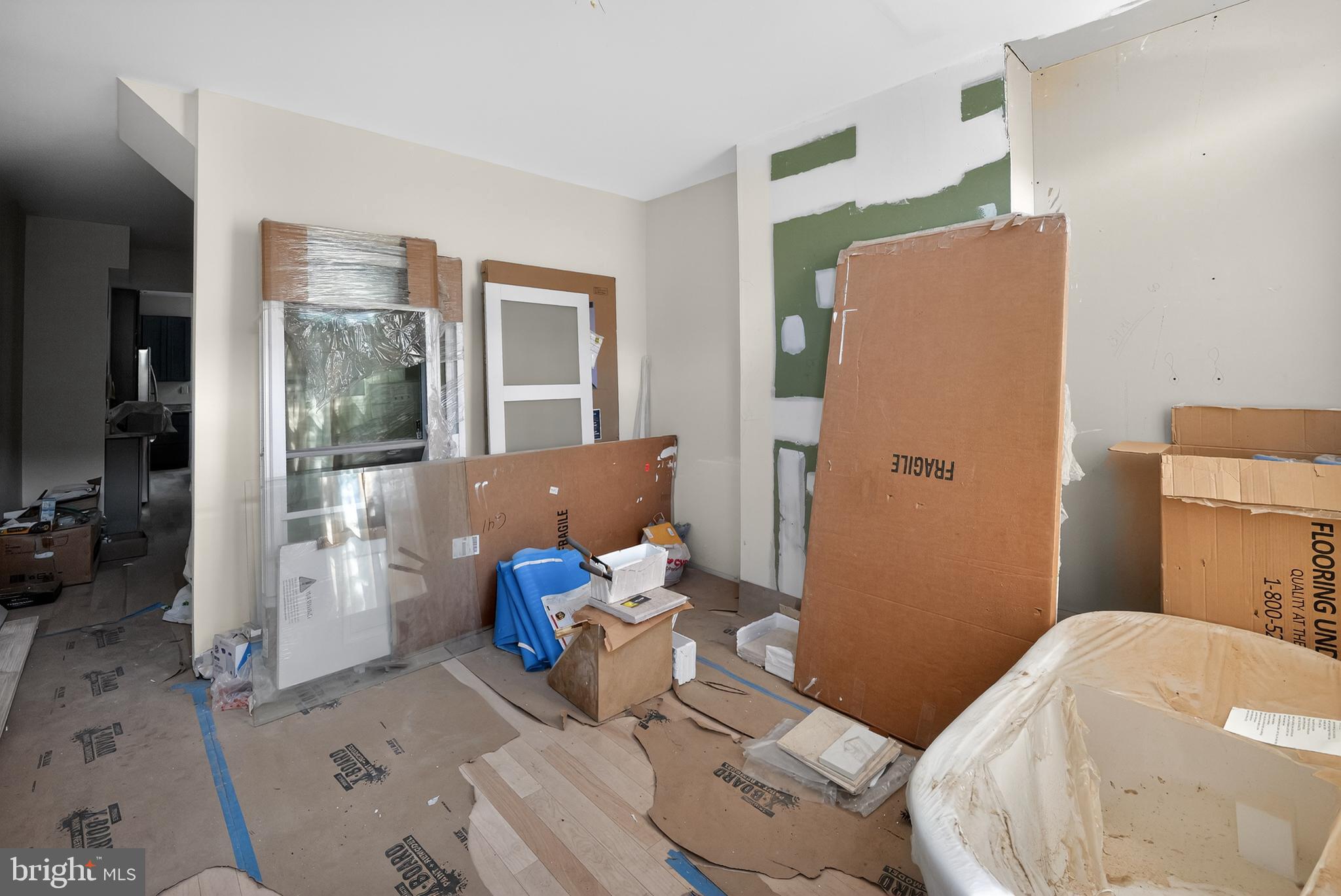 714 Portland Street Baltimore, MD 21230 - Photo 10 of 18 a living room with furniture and a large window