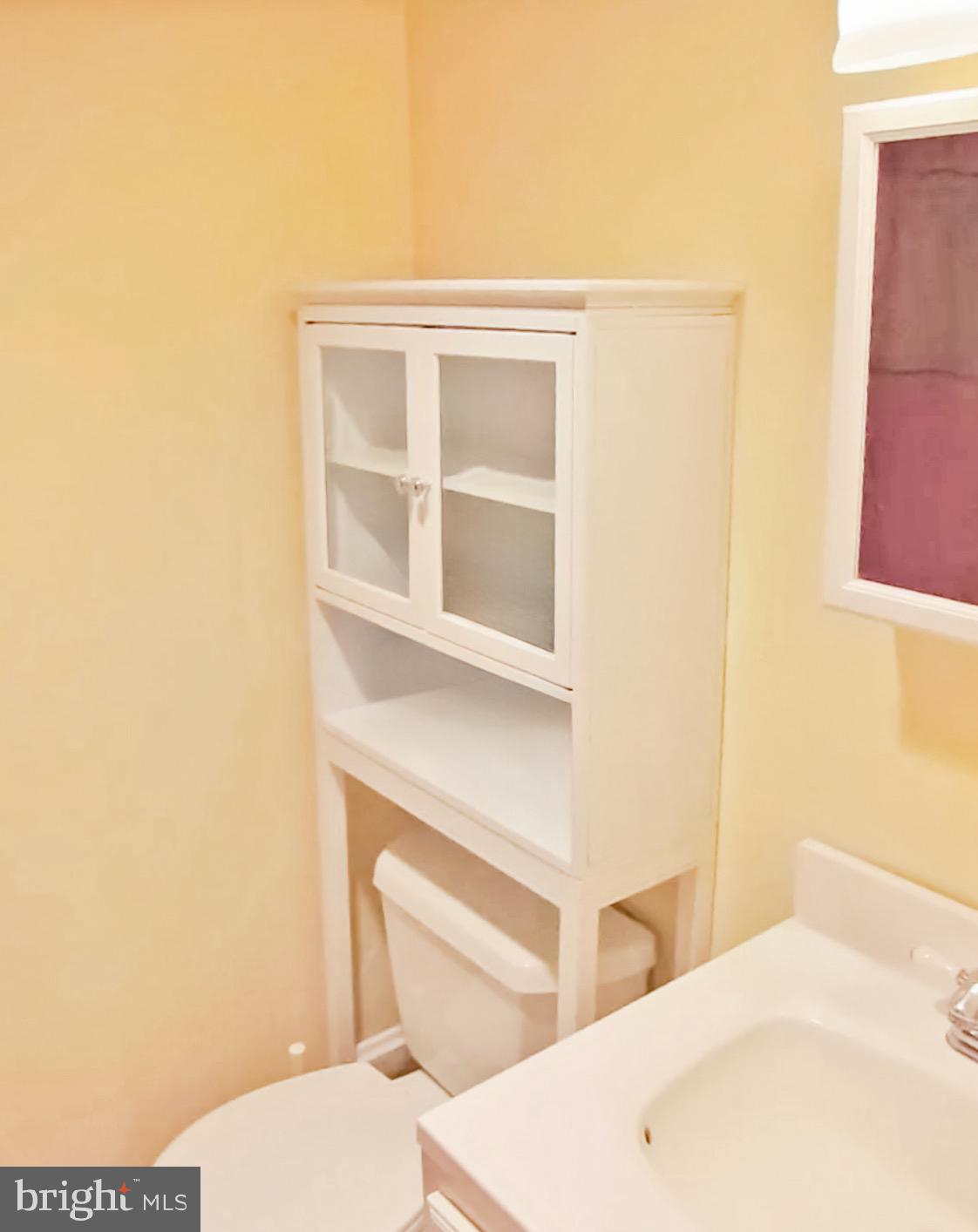 2030 F Street Northwest, Unit 211 Washington, DC 20006 - Photo 9 of 10 a bathroom with a toilet and a sink