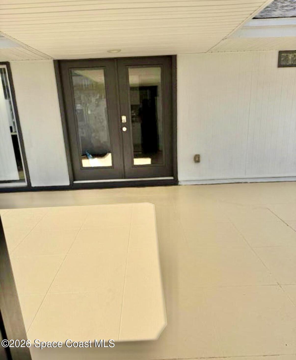 938 Brunswick Lane Rockledge, FL 32955 - Photo 15 of 21 Frnt courtyard off kitch.