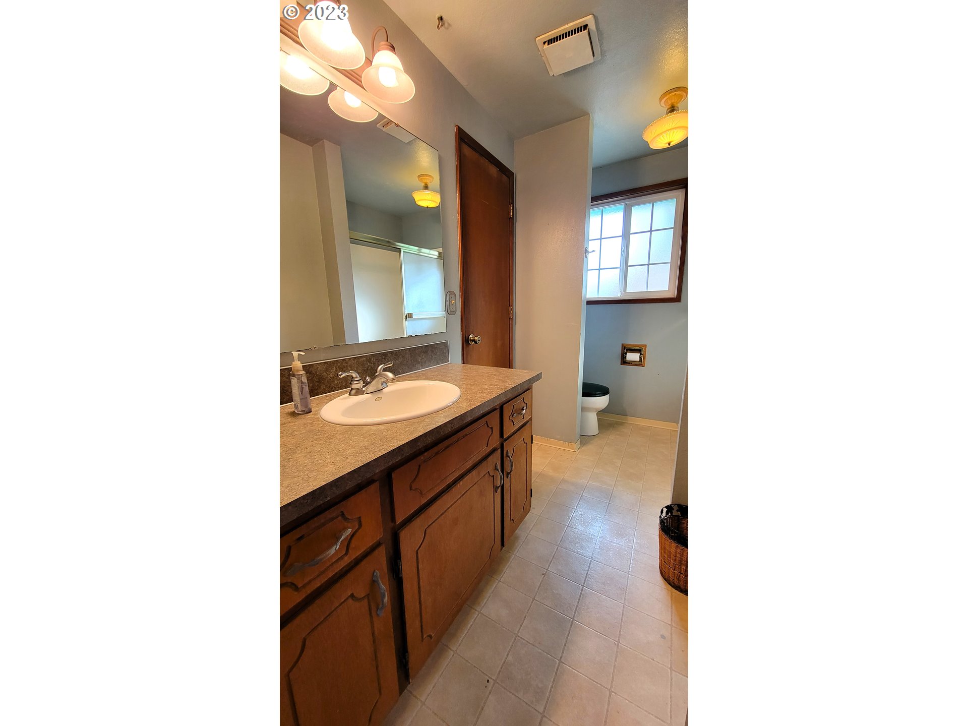 2055 Praslin Street Eugene, OR 97402 - Photo 9 of 14 a bathroom with a sink double vanity and a mirror