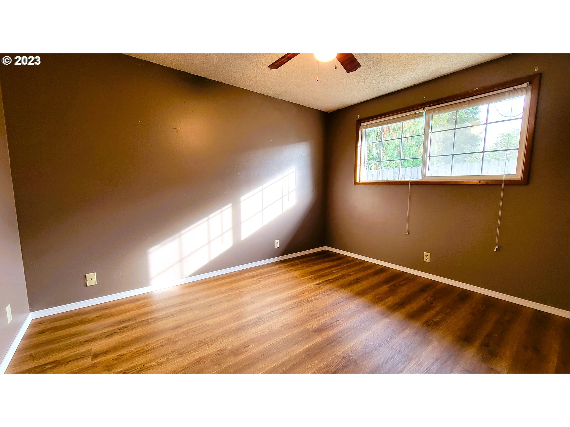 2055 Praslin Street Eugene, OR 97402 - Photo 10 of 14 a view of an empty room and window
