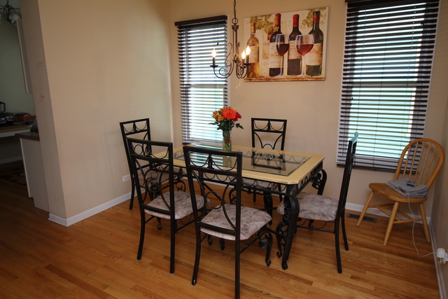 184 South Channing Street Elgin, IL 60120 - Photo 5 of 9 a dining room with furniture and wooden floor