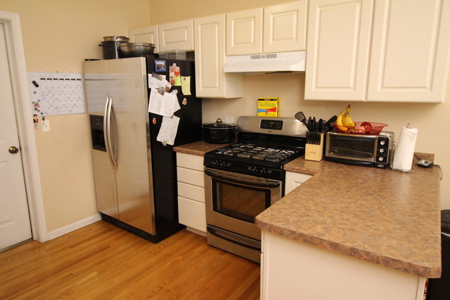 184 South Channing Street Elgin, IL 60120 - Photo 6 of 9 a kitchen with stainless steel appliances granite countertop a refrigerator stove and sink