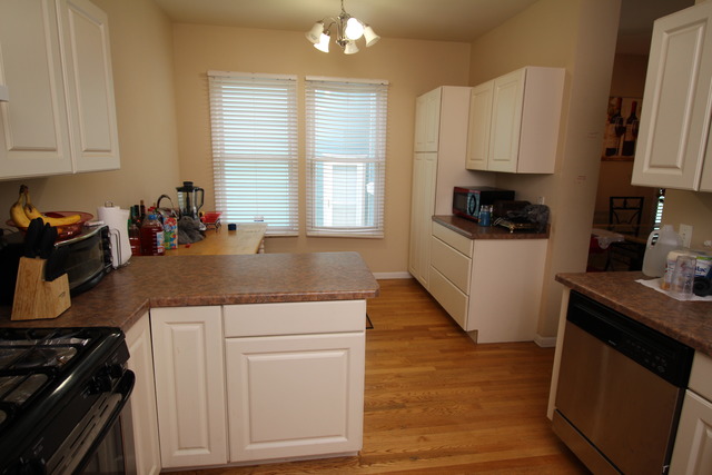 184 South Channing Street Elgin, IL 60120 - Photo 7 of 9 a kitchen with a stove and a white cabinets