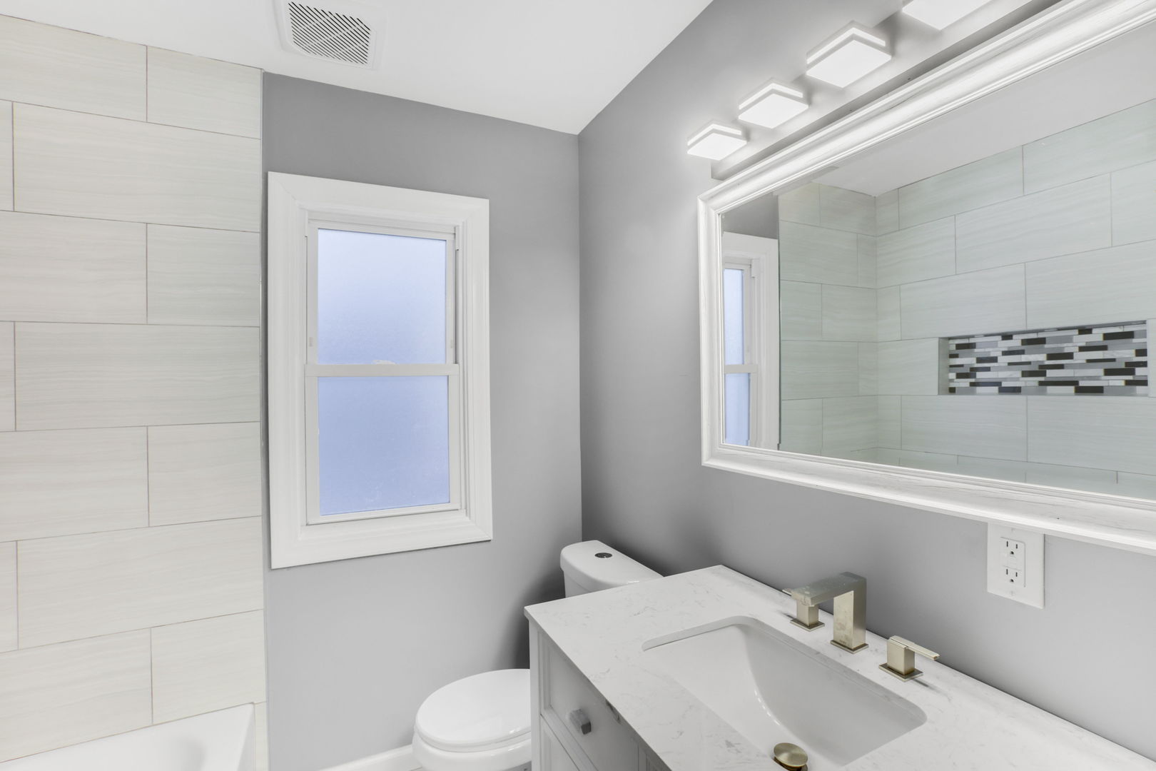 3250 186th Street Lansing, IL 60438 - Photo 6 of 18 a bathroom with a sink mirror and toilet