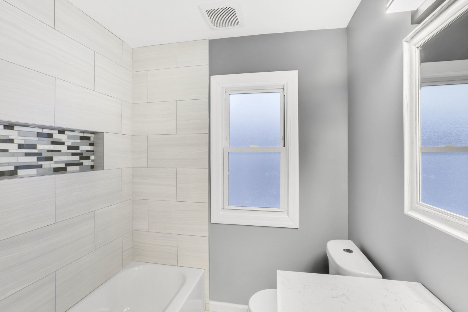 3250 186th Street Lansing, IL 60438 - Photo 7 of 18 a bathroom with a toilet a sink and mirror