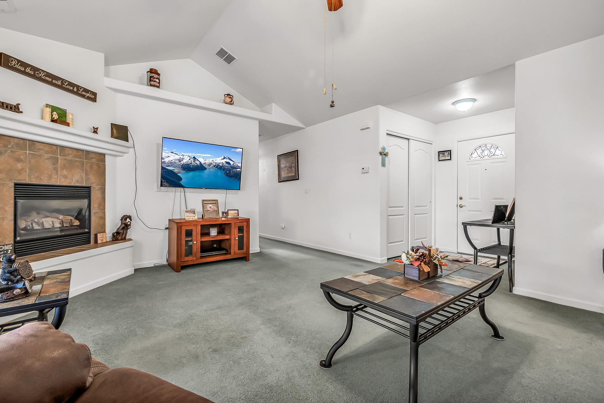 2833 B B 3/10 Road Grand Junction, CO 81503 - Photo 11 of 35 a living room with furniture and a flat screen tv