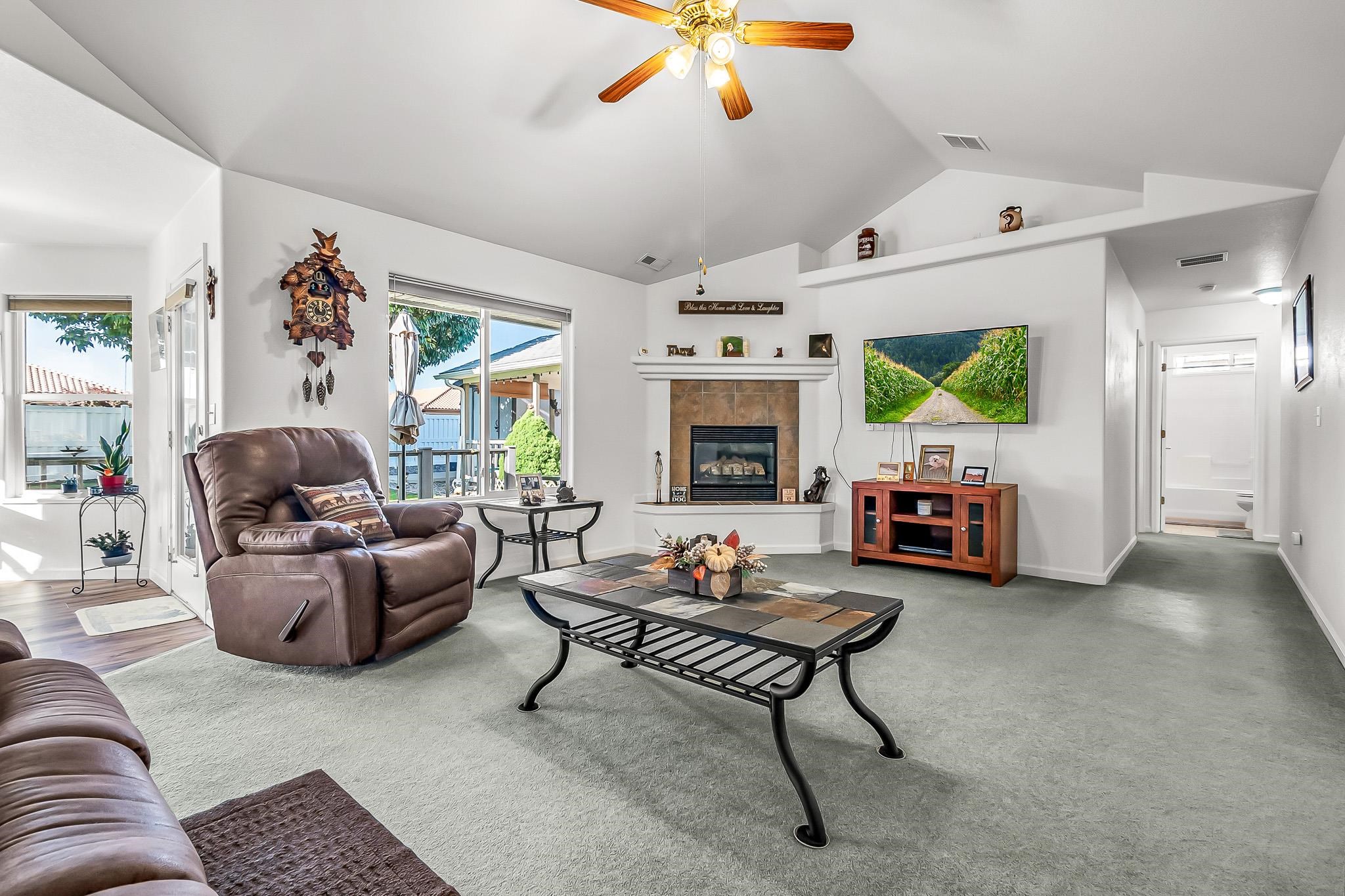 2833 B B 3/10 Road Grand Junction, CO 81503 - Photo 12 of 35 a living room with furniture and a flat screen tv
