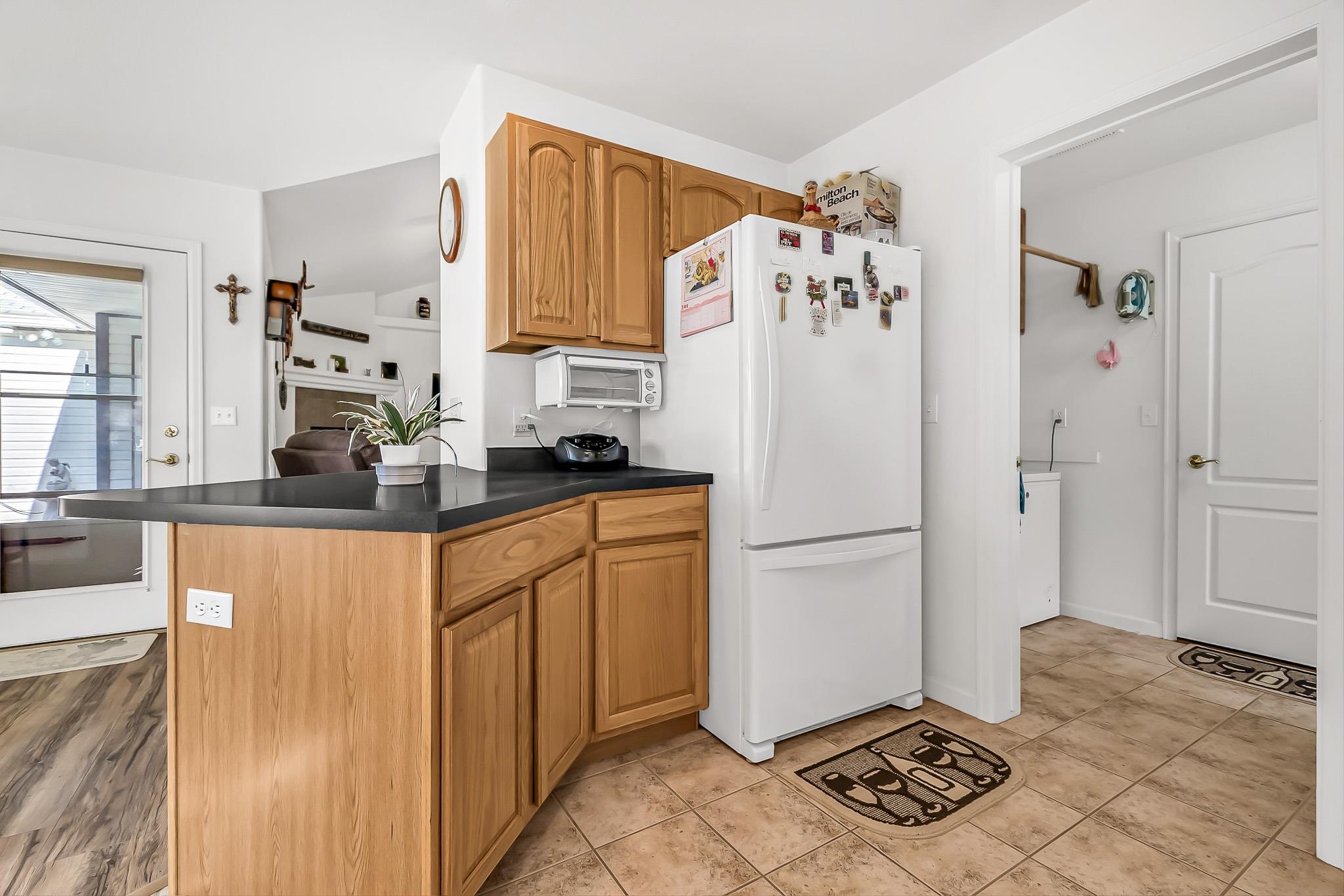 2833 B B 3/10 Road Grand Junction, CO 81503 - Photo 15 of 35 a white refrigerator freezer sitting inside of a kitchen