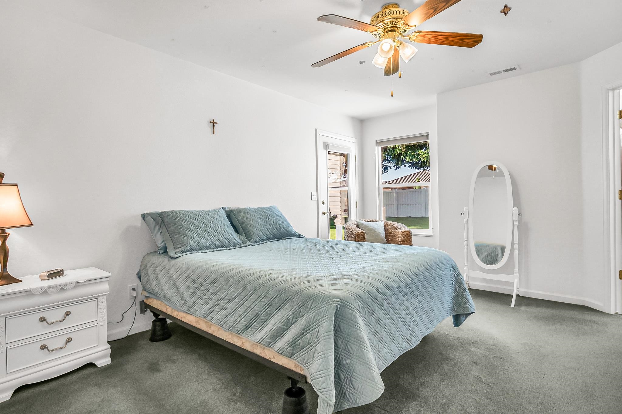 2833 B B 3/10 Road Grand Junction, CO 81503 - Photo 19 of 35 a bedroom with a bed and a chandelier