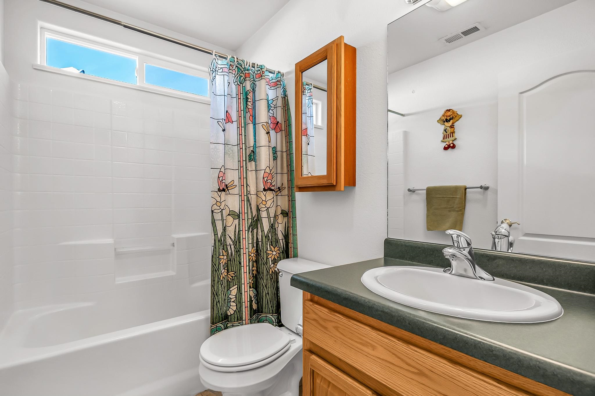 2833 B B 3/10 Road Grand Junction, CO 81503 - Photo 27 of 35 a bathroom with a granite countertop sink toilet and shower