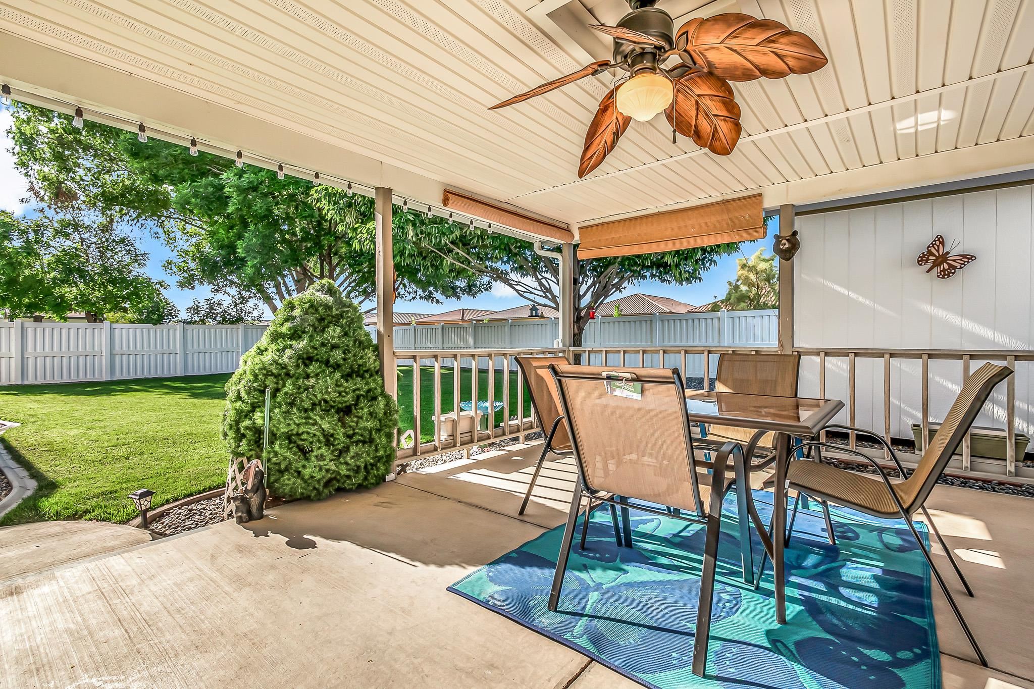 2833 B B 3/10 Road Grand Junction, CO 81503 - Photo 29 of 35 a view of a patio with table and chairs potted plants with wooden floor