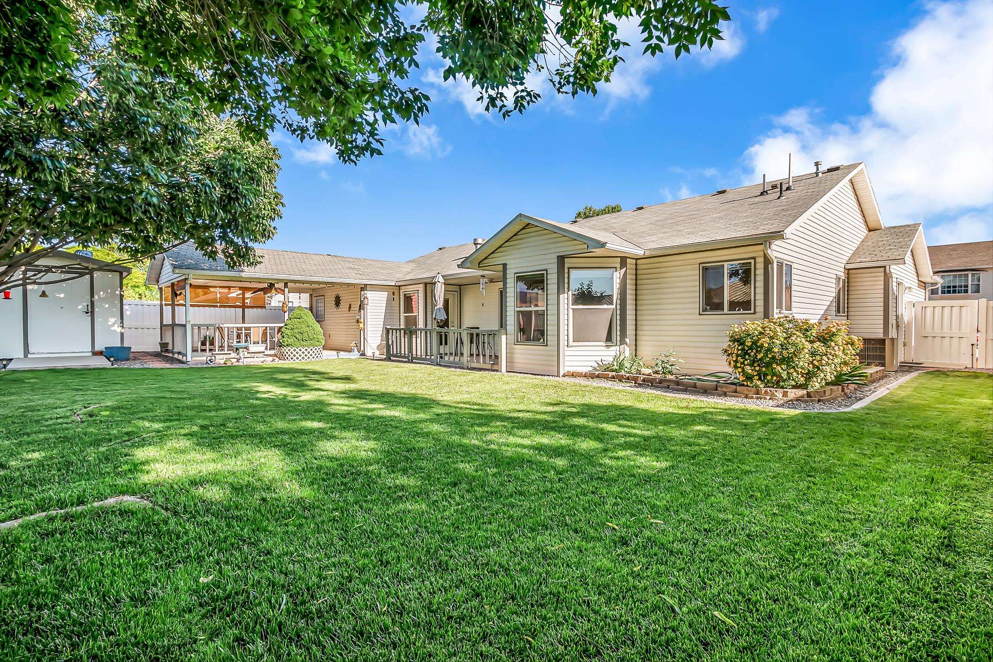 2833 B B 3/10 Road Grand Junction, CO 81503 - Photo 34 of 35 a front view of a house with a garden