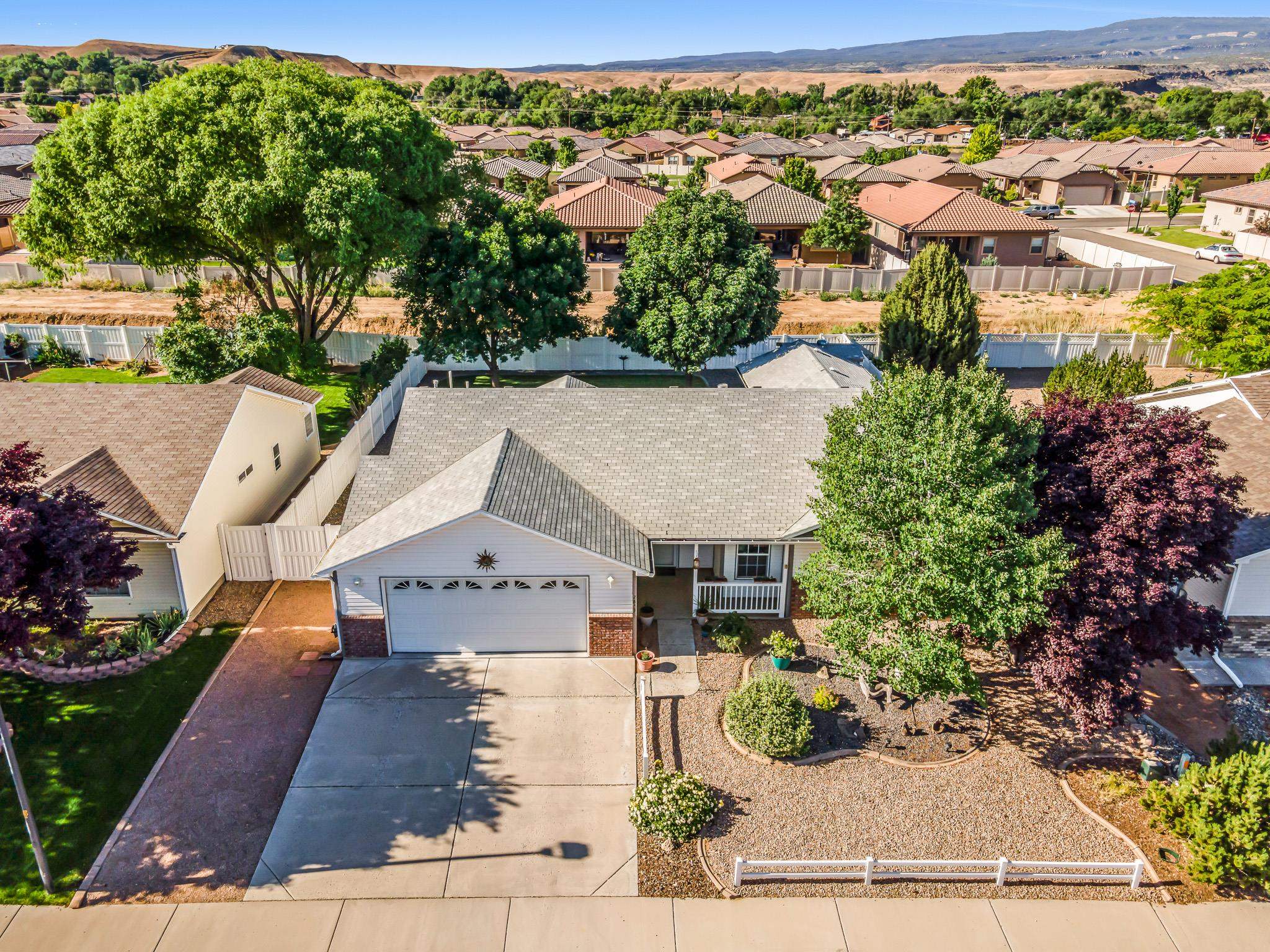 2833 B B 3/10 Road Grand Junction, CO 81503 - Photo 6 of 35 an aerial view of a house with a garden