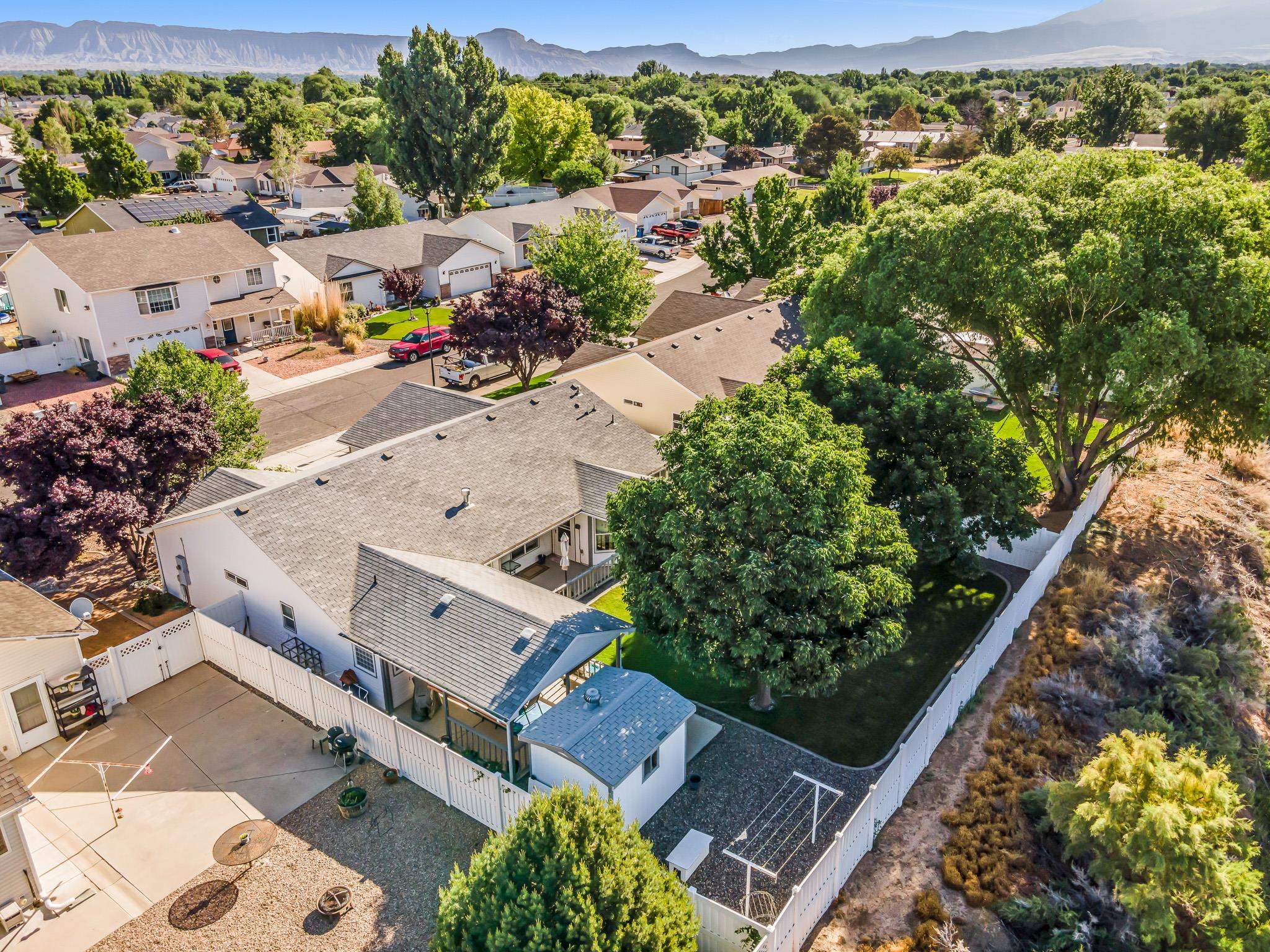 2833 B B 3/10 Road Grand Junction, CO 81503 - Photo 8 of 35 an aerial view of a house with a garden