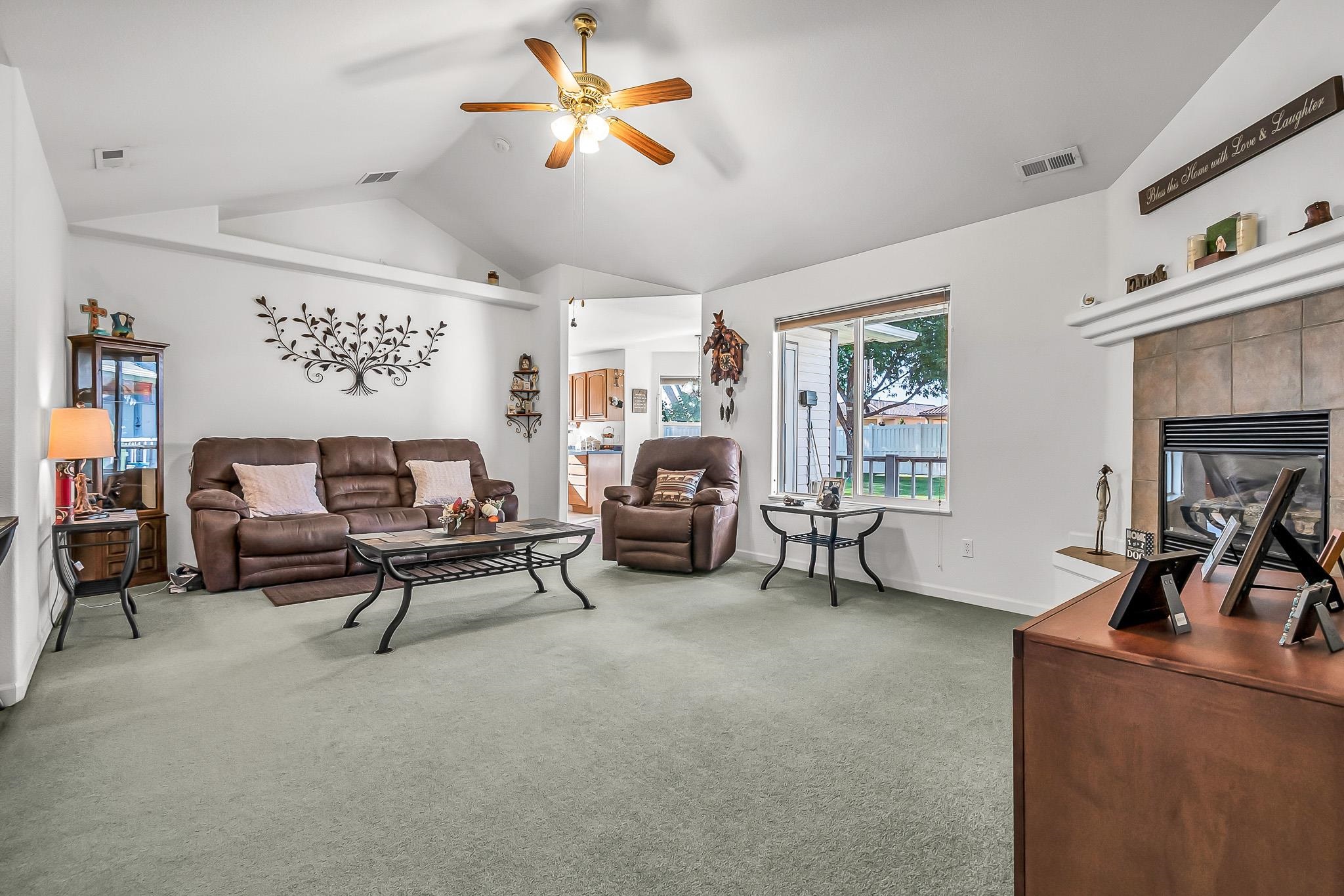 2833 B B 3/10 Road Grand Junction, CO 81503 - Photo 10 of 35 a living room with furniture and a chandelier